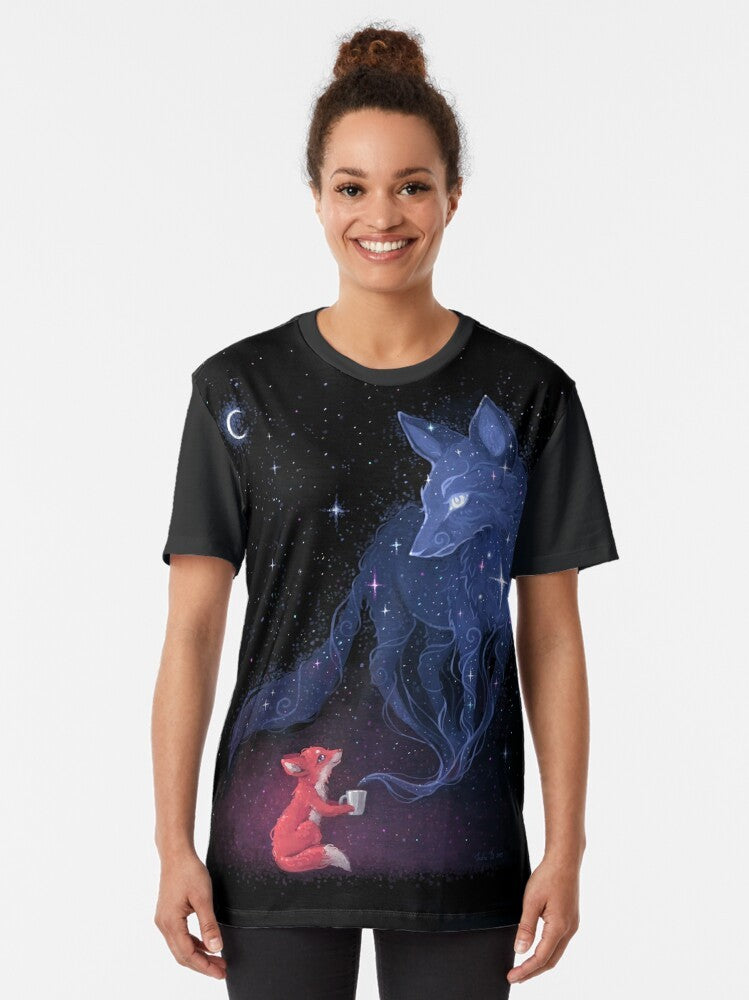 Celestial graphic t-shirt featuring a cute fox character surrounded by stars, moons, and cosmic elements - Women