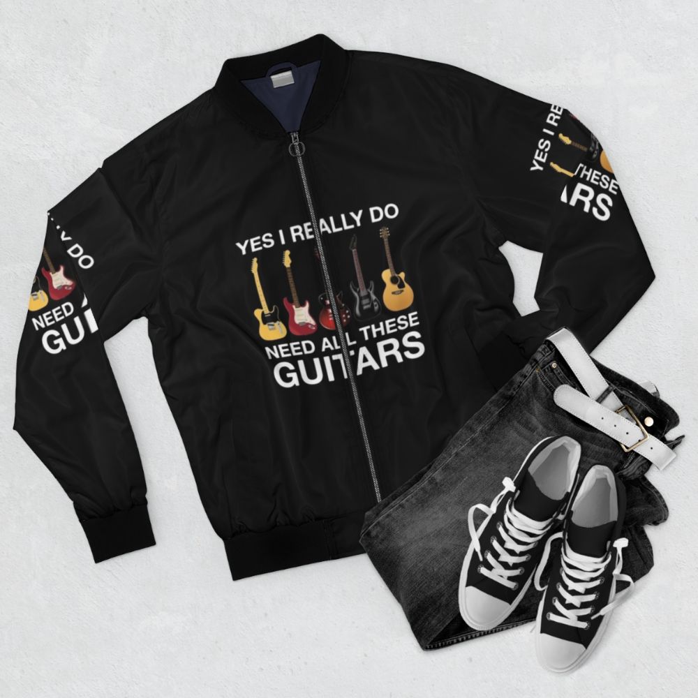 "Yes I Really Do Need All These Guitars" bomber jacket for guitar players and music lovers - Flat lay