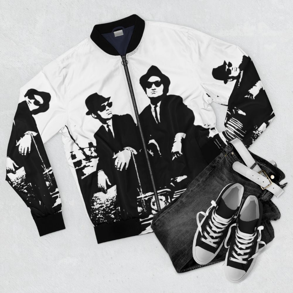 Vintage-style bomber jacket inspired by the Blues Brothers movie, featuring the iconic look - Flat lay