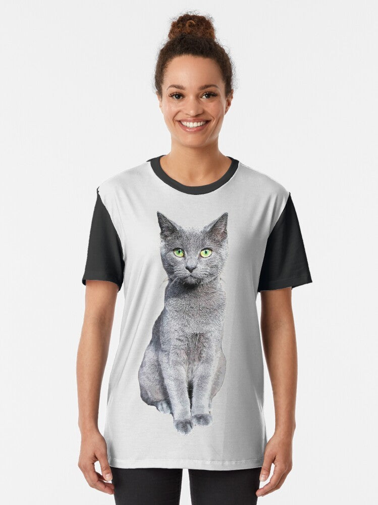 Closeup photo of a cute and fluffy Russian Blue kitten with striking green eyes on a grey graphic t-shirt. - Women