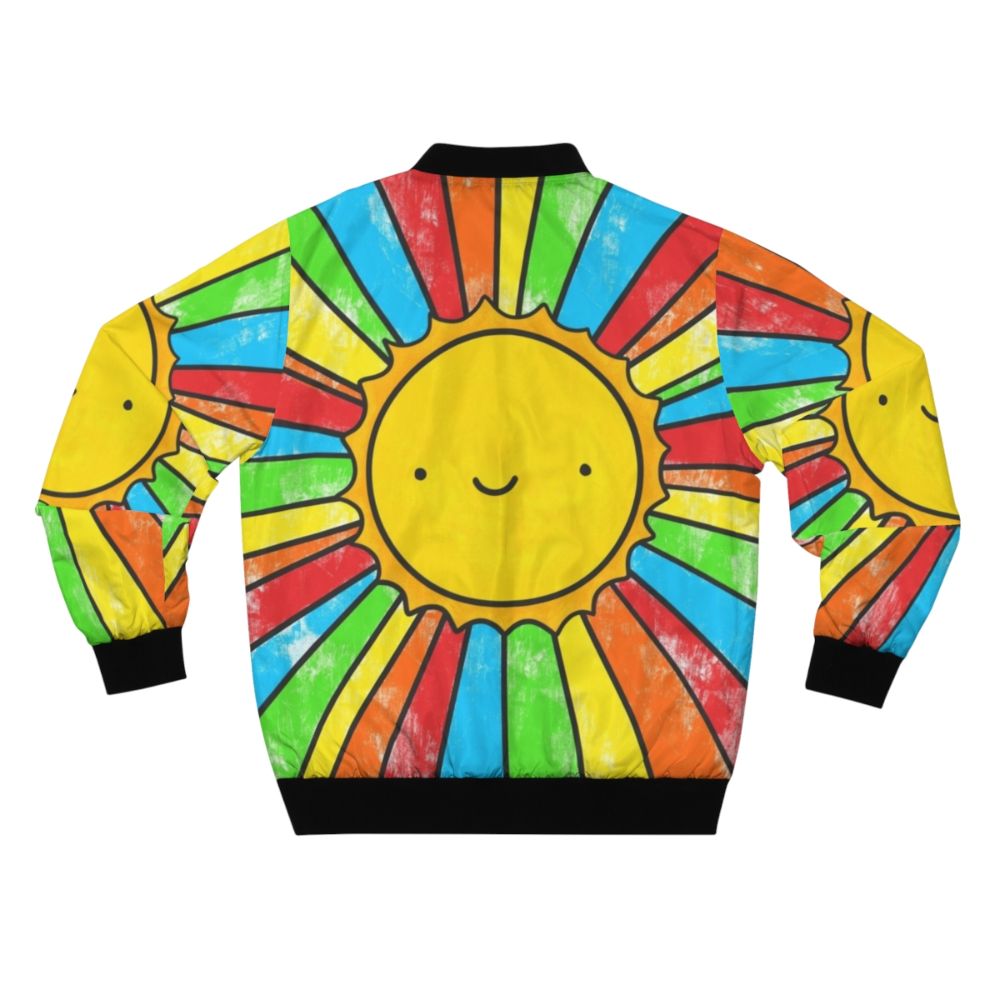 A colorful bomber jacket with a radiant sunshine, rainbows, and a positive quote to spread happiness and positivity. - Back