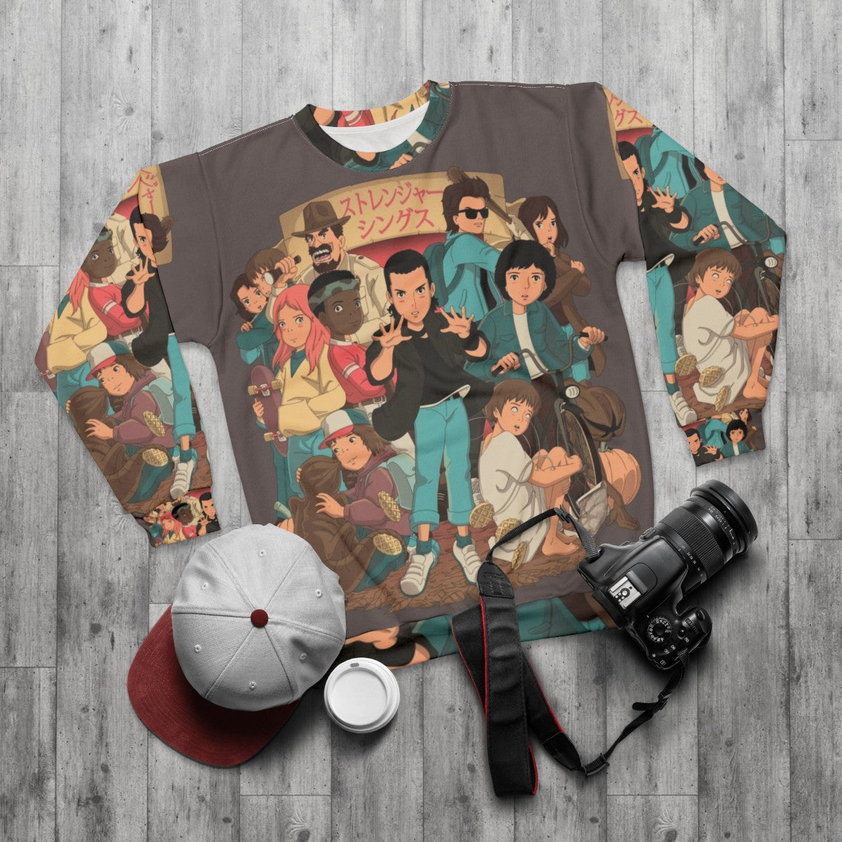 Stranger Things Anime 2 Sweatshirt featuring characters from the popular Netflix series - flat lay