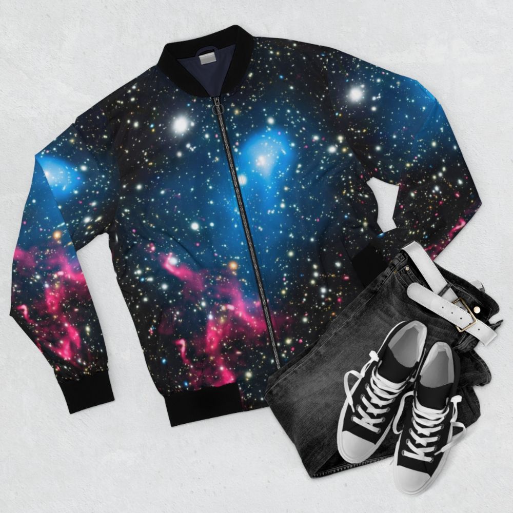 Bomber jacket with a print of galaxies colliding in space - Flat lay