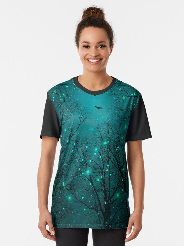 Teal galaxy night stars graphic t-shirt featuring a design of glowing stars, geometric constellations, and abstract tree artwork. - Women