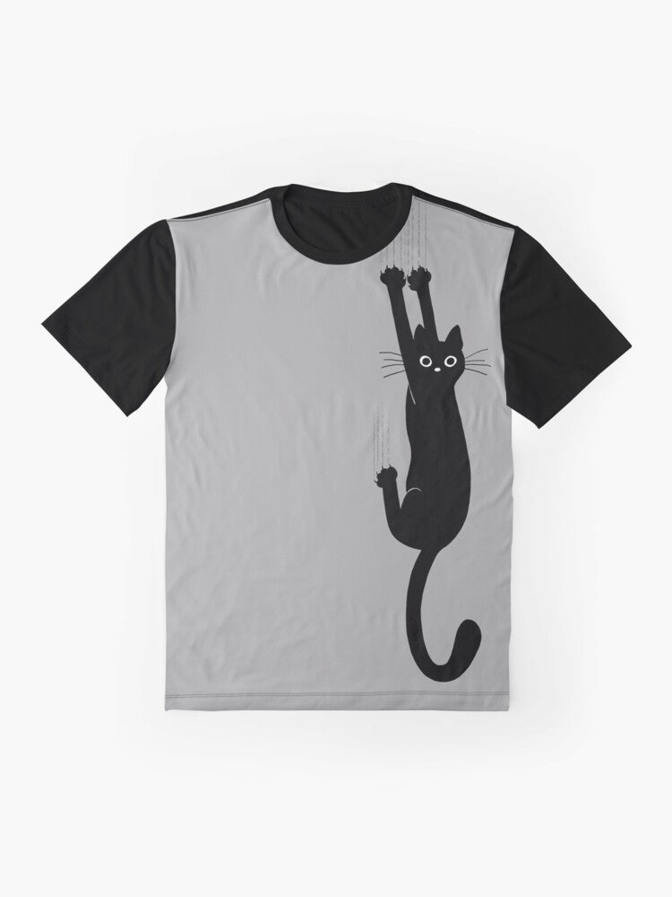 Graphic t-shirt featuring a black cat holding on with its claws and an expression of perseverance and humor - Flat lay