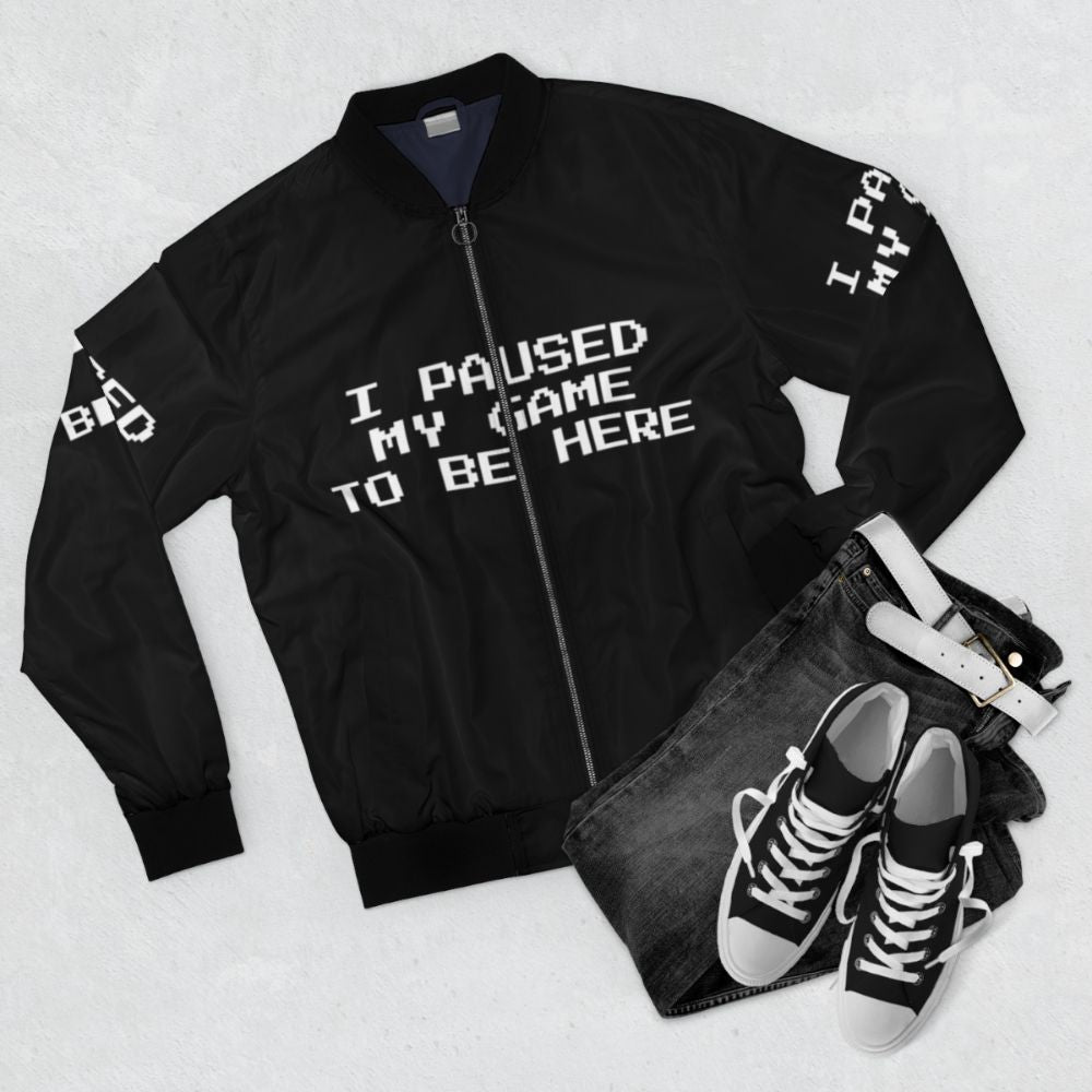 Gamer geek bomber jacket with "I Paused My Game To Be Here" text - Flat lay