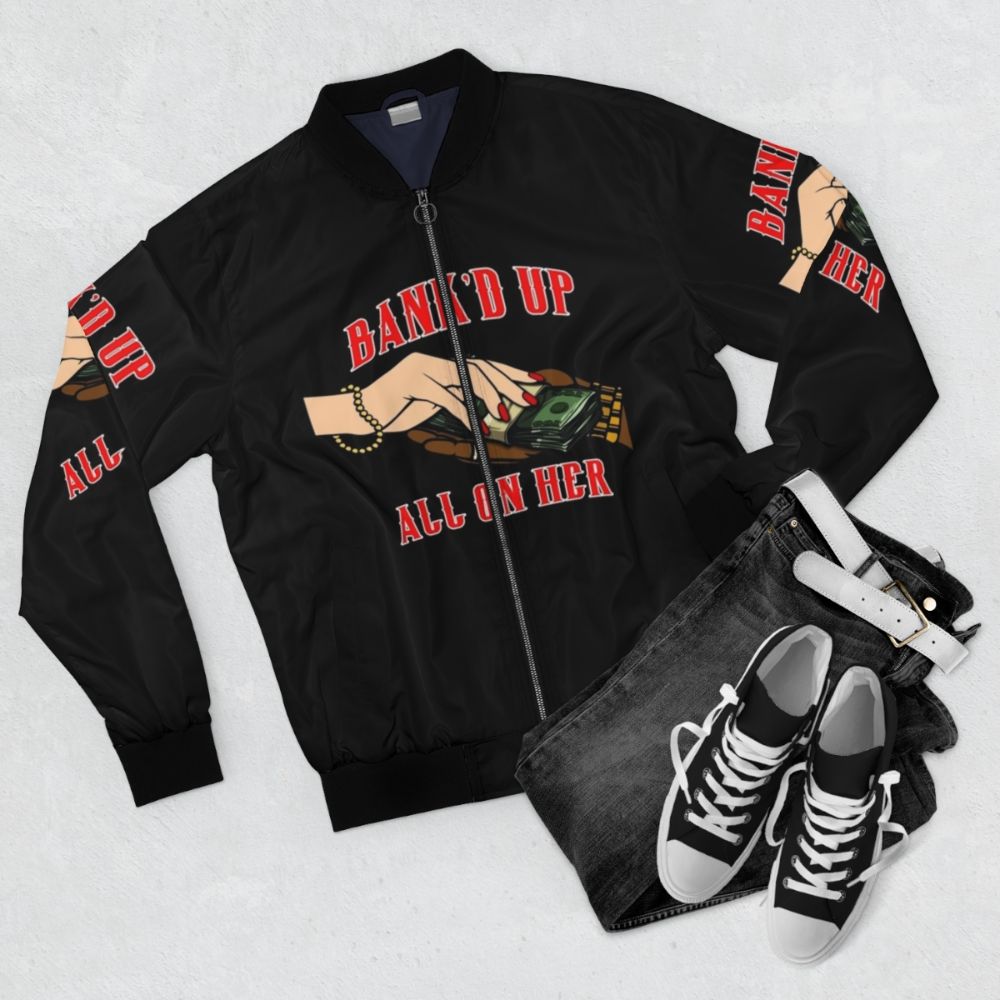 A black and red bomber jacket with a bold urban design. - Flat lay