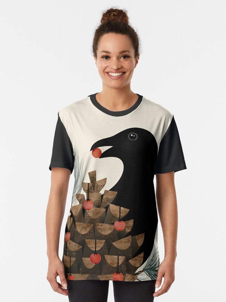 Elegant watercolor graphic t-shirt featuring a bird silhouette design with pine branches and berries, perfect for winter and nature lovers. - Women