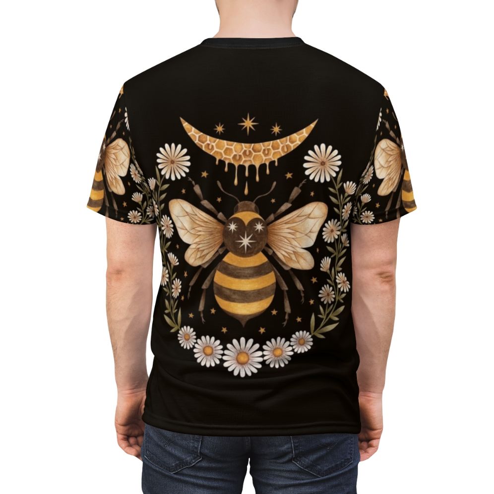 A black t-shirt featuring a honey moon design with bees, flowers, and a laurel wreath - men back