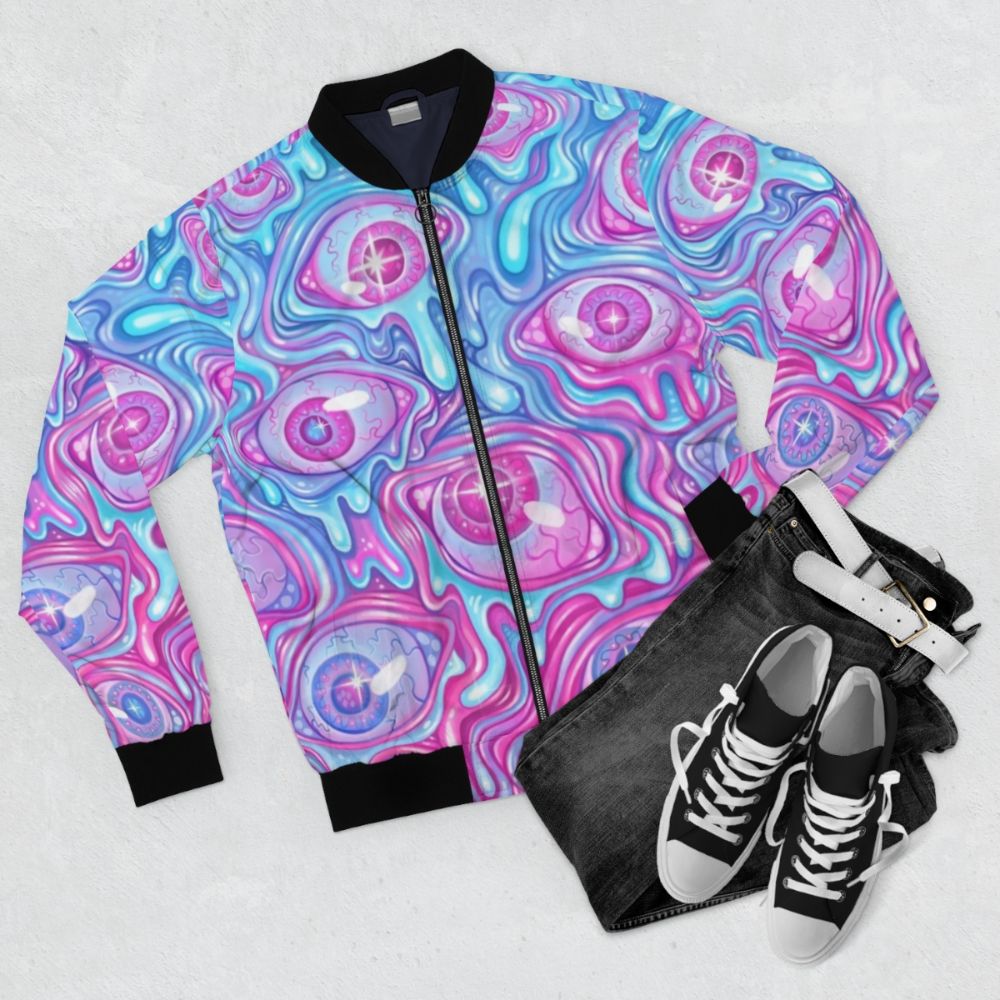 A colorful and creepy bomber jacket with an eyeball pattern design. - Flat lay