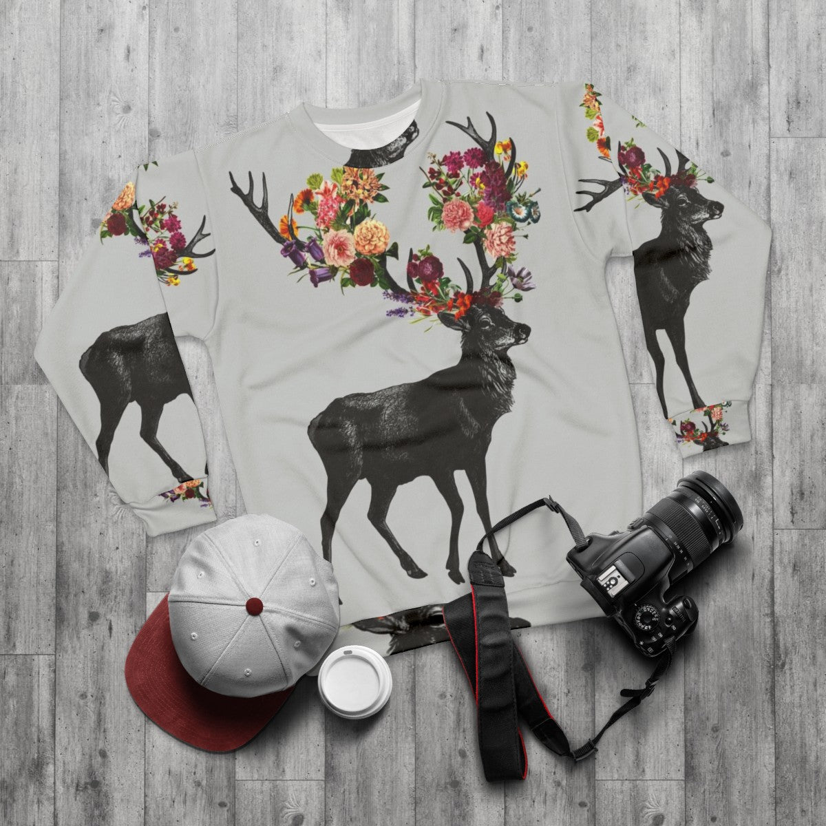 Floral sweatshirt with a nature-inspired deer design - flat lay