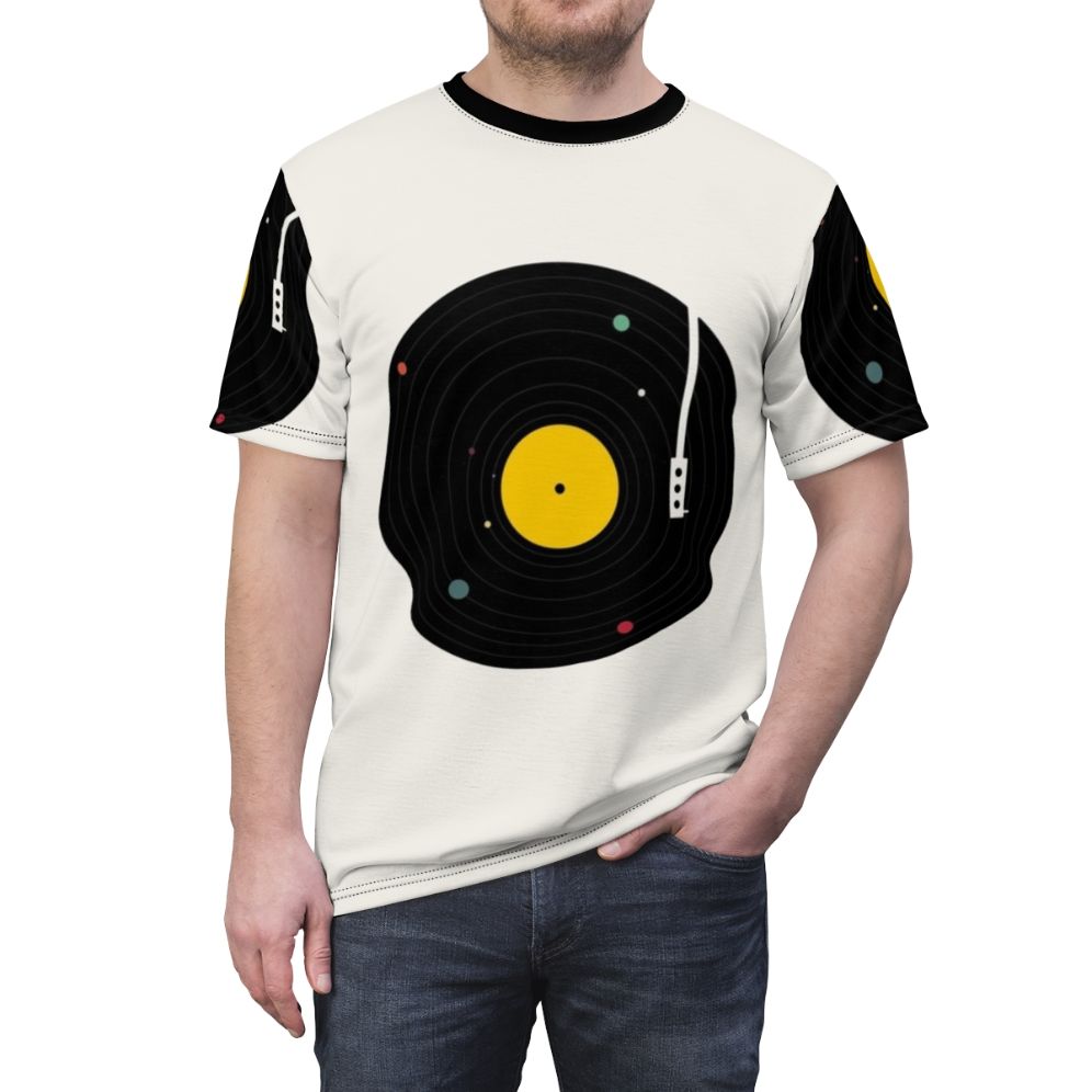 Cosmic music graphic t-shirt featuring a retro record player and planets in a minimalist space design - men front