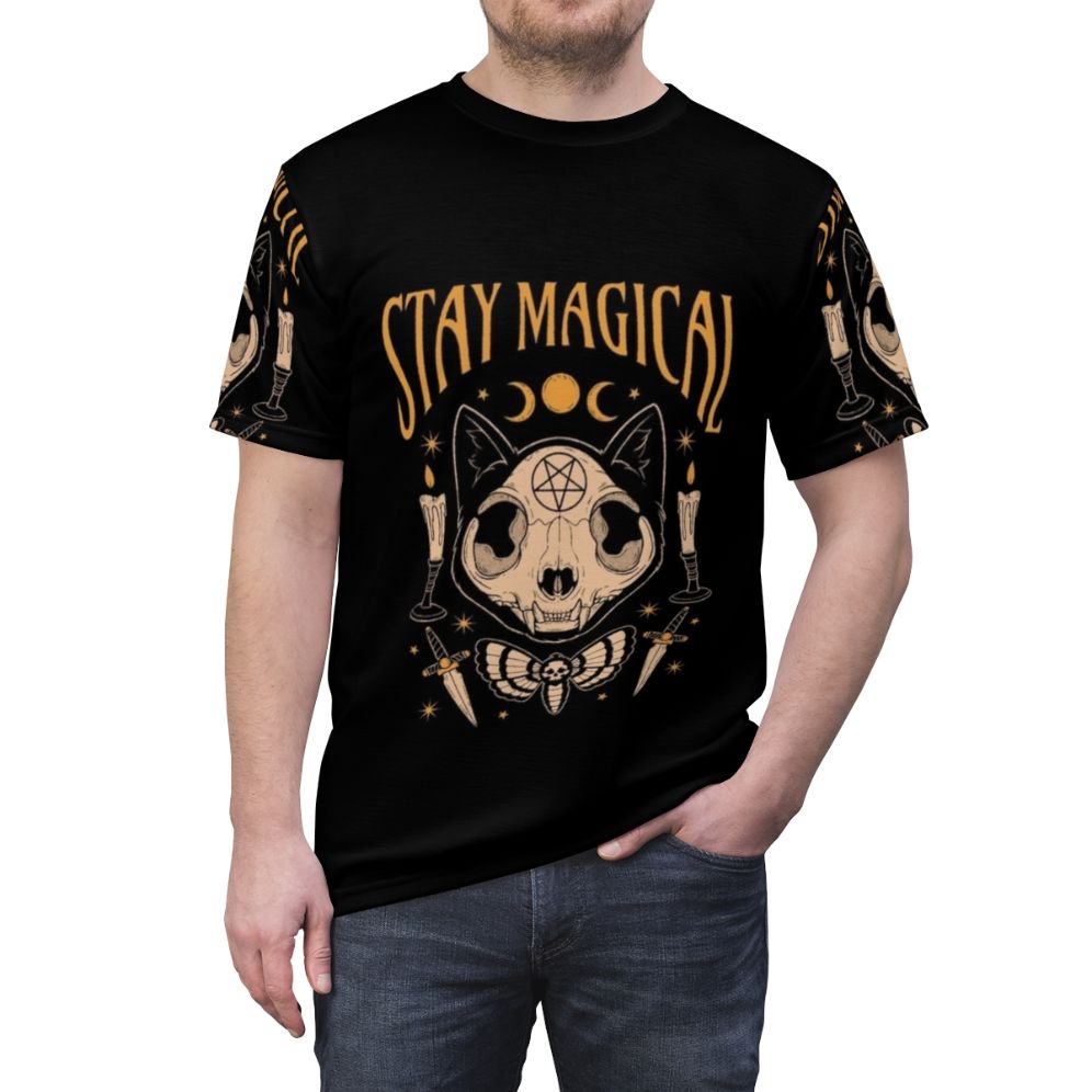 Person wearing a t-shirt featuring a mystical cat skull design with occult and astrological elements. - men front