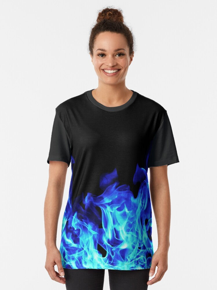 A graphic t-shirt featuring bold blue flames with an electric, neon design against a dark background. - Women