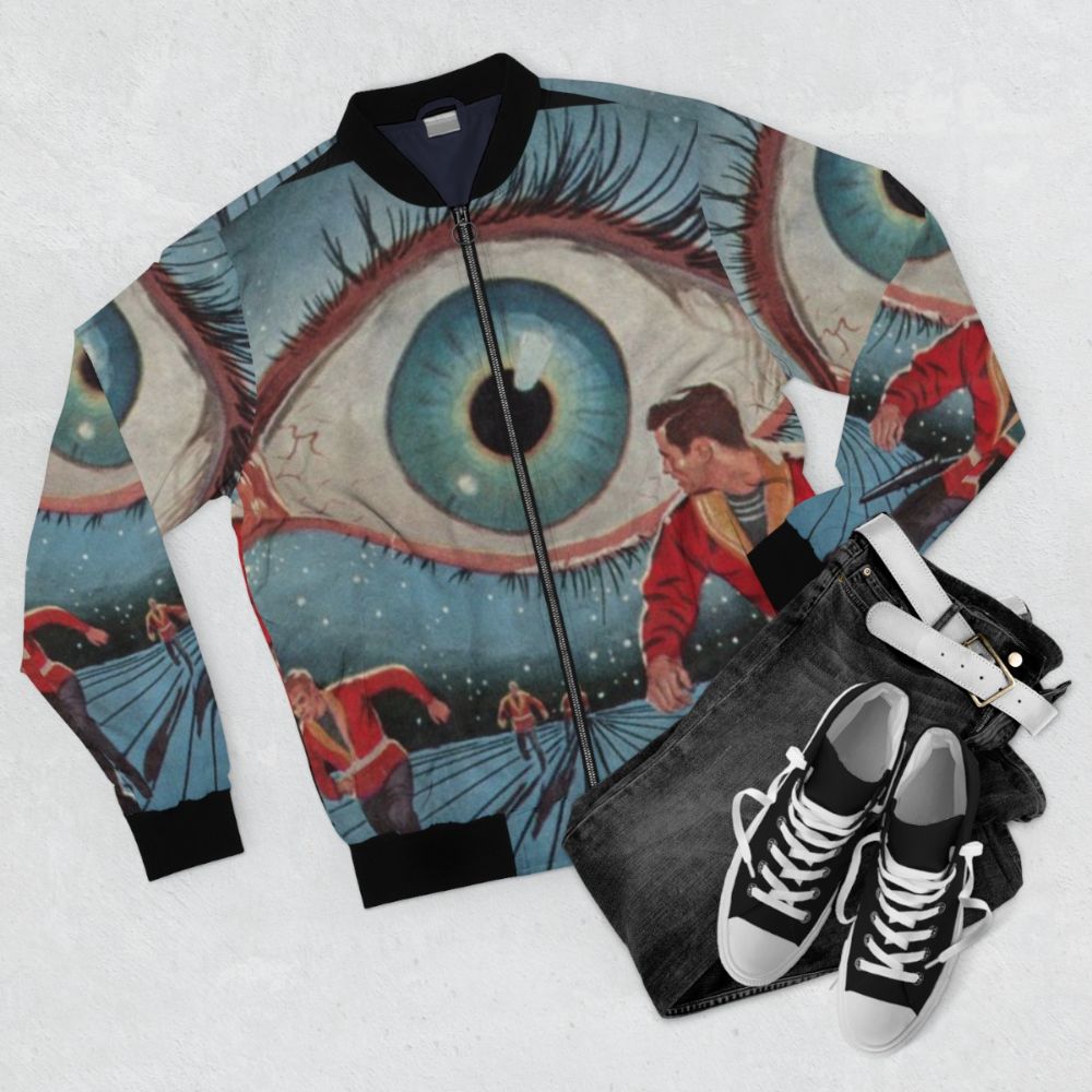 Stylish bomber jacket with futuristic, sci-fi inspired design elements like slotted eyes, metallic teeth, and mechanical arm. - Flat lay