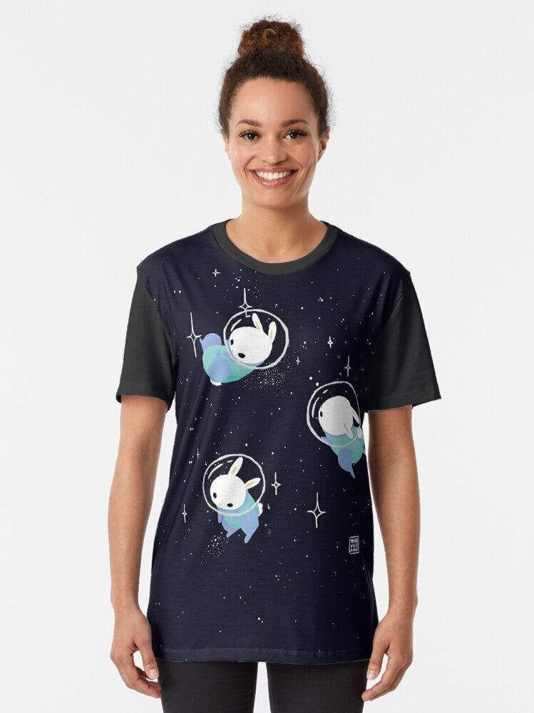 Adorable space bunnies in a digital illustration, featuring a cute, kawaii design with stars, planets, and a galaxy background. - Women