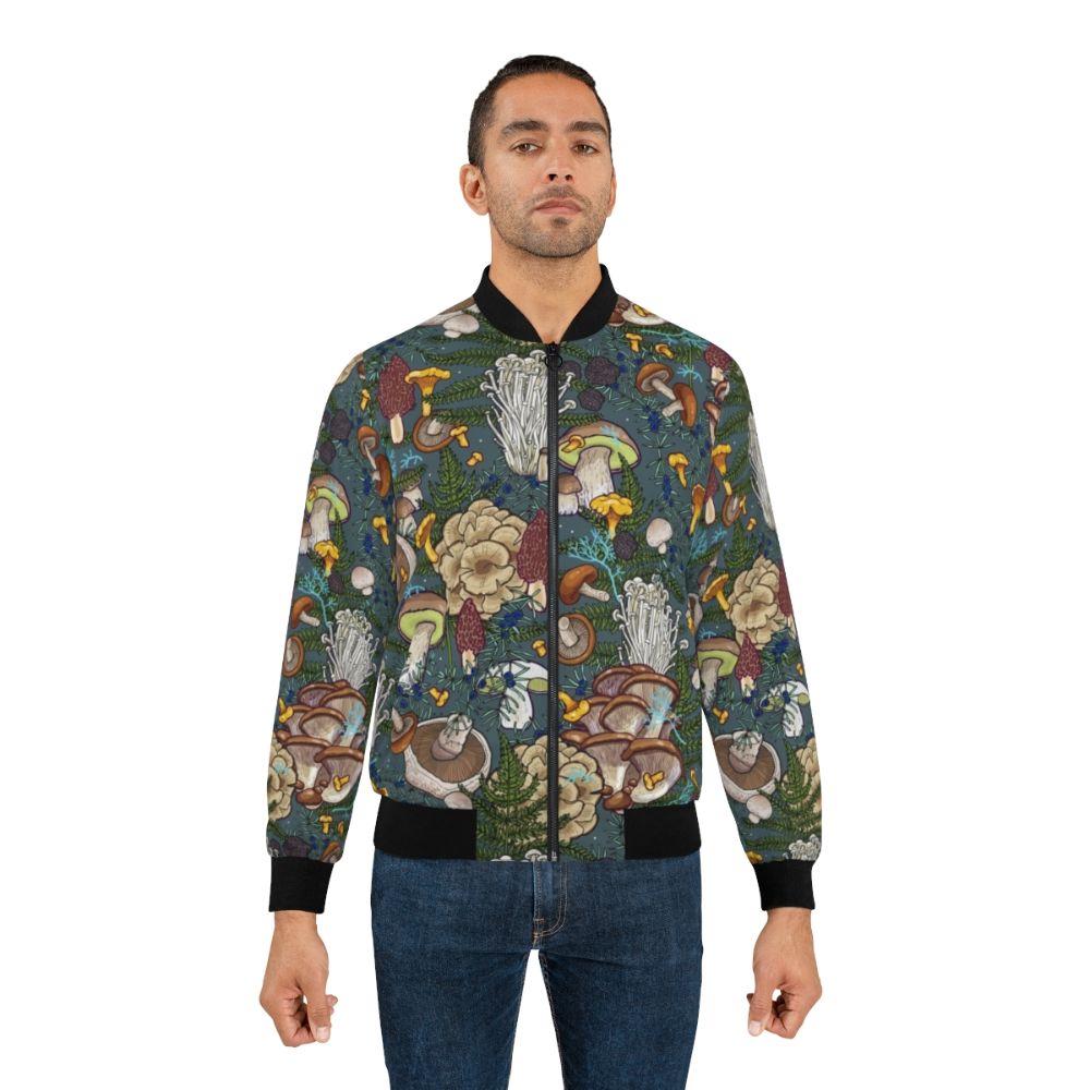 A bomber jacket featuring a pattern of various mushrooms and foliage in a forest setting. - Lifestyle