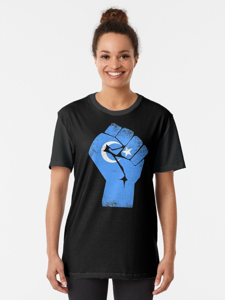 Free the Uyghurs graphic t-shirt with text supporting the Uyghur people and condemning China's human rights abuses. - Women