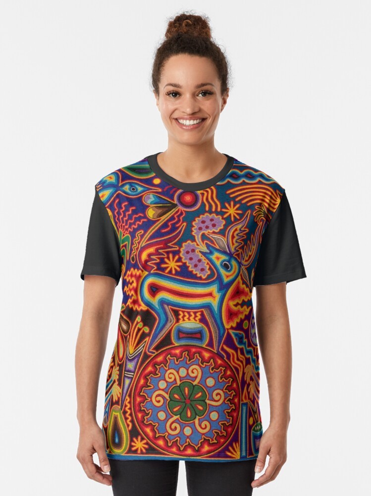 Vibrant Huichol-inspired graphic t-shirt featuring colorful Mexican cultural elements and symbols like skulls, flowers, and abstract patterns. - Women