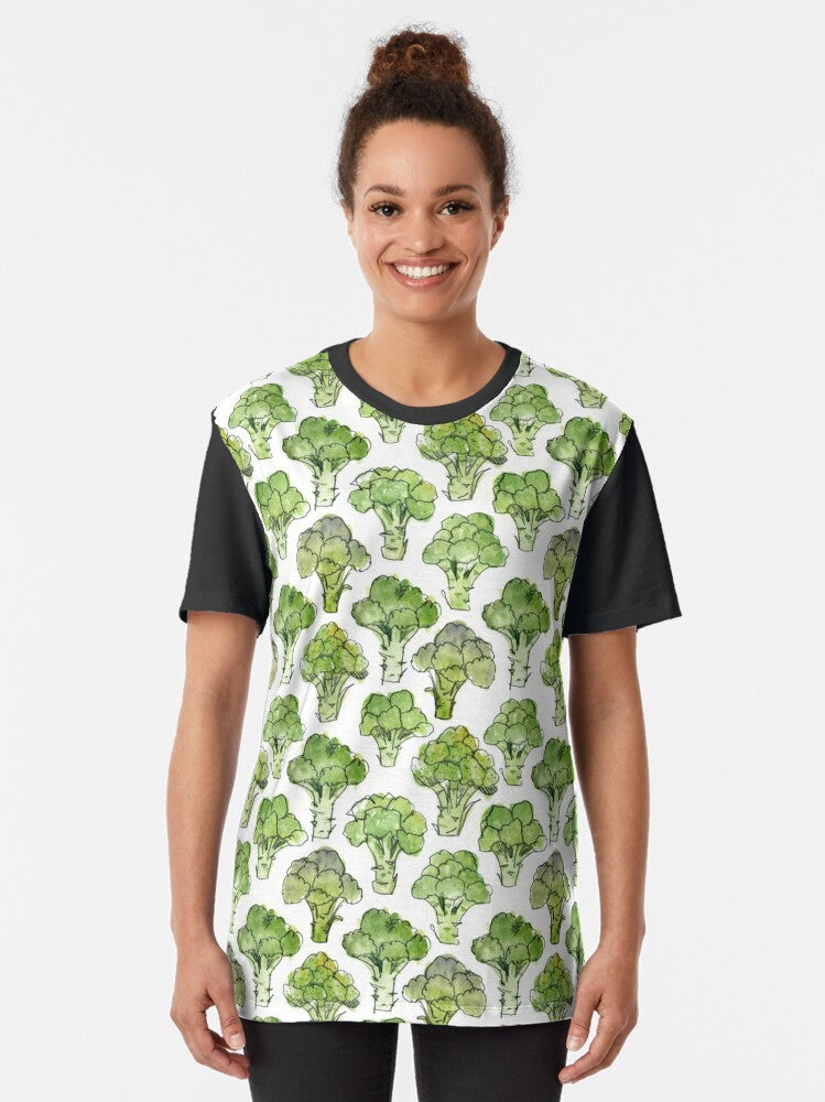 Watercolor illustration of broccoli florettes and flowers on a green t-shirt. - Women