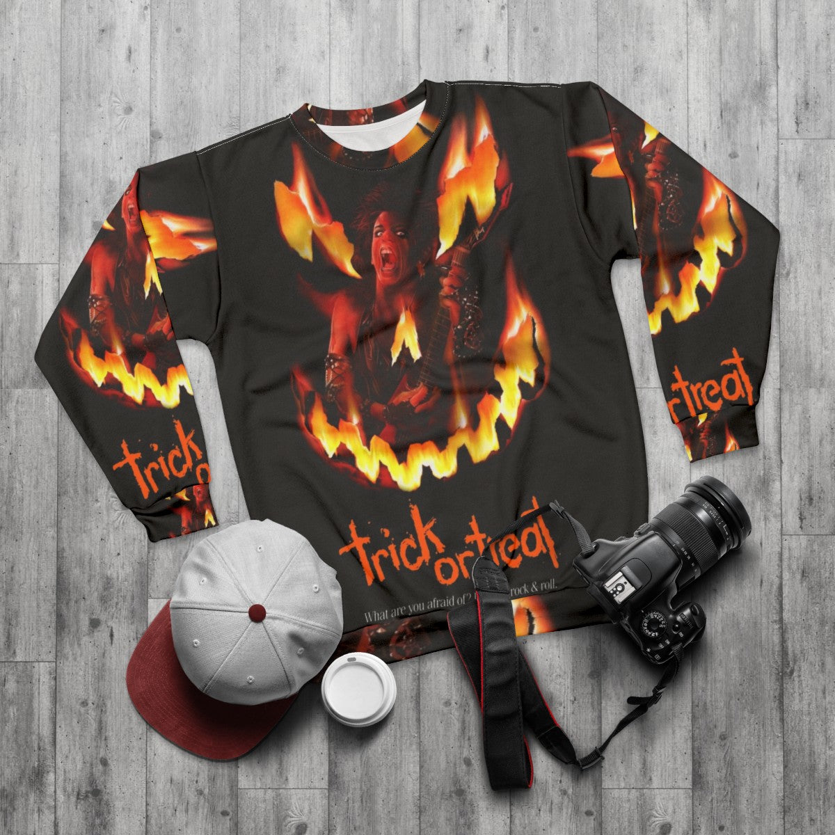 Trick or Treat Sweatshirt featuring horror movie inspired retro rock graphics - flat lay