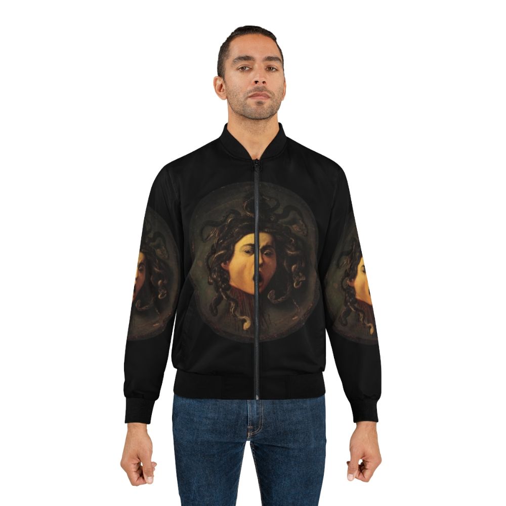 A bomber jacket featuring the iconic image of Medusa, the gorgon from Greek mythology, in a Caravaggio-style realist painting. - Lifestyle