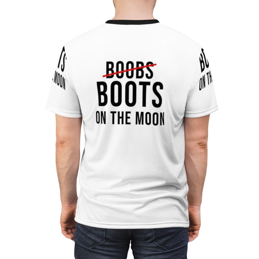 Graphic t-shirt design featuring an out-of-this-world image of boobs and boots on the moon - men back