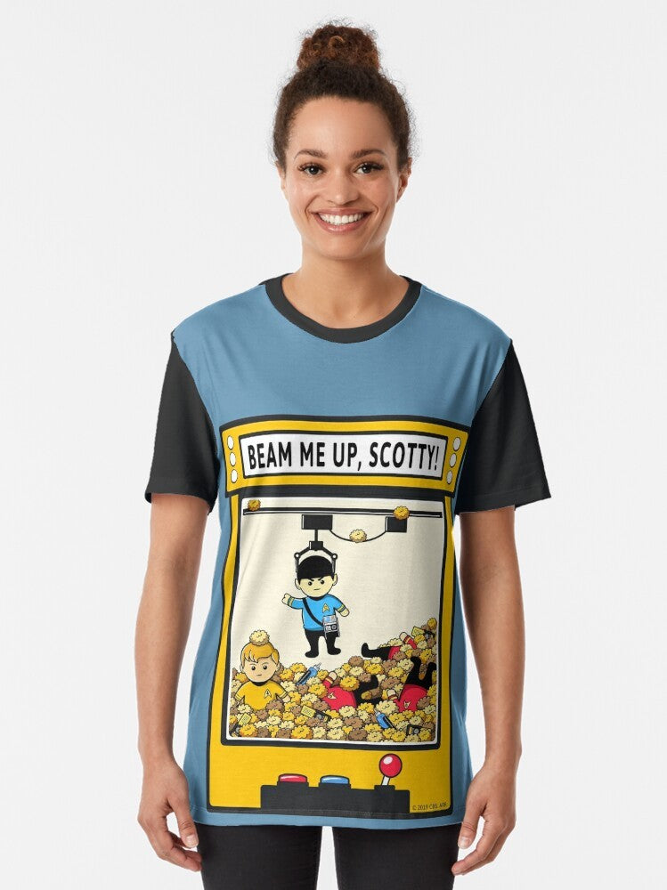 A Star Trek graphic tee with the iconic "Beam Me Up, Scotty" quote and characters like Spock and Captain Kirk. - Women