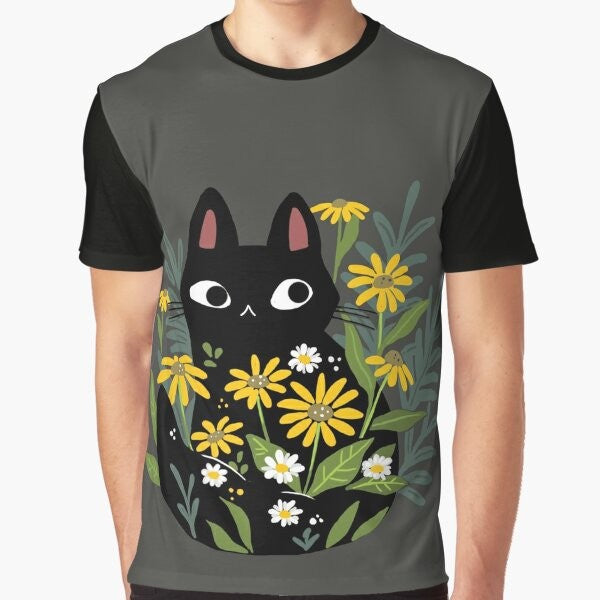 A charming graphic t-shirt featuring a black cat surrounded by vibrant flowers, creating a whimsical and nature-inspired design.