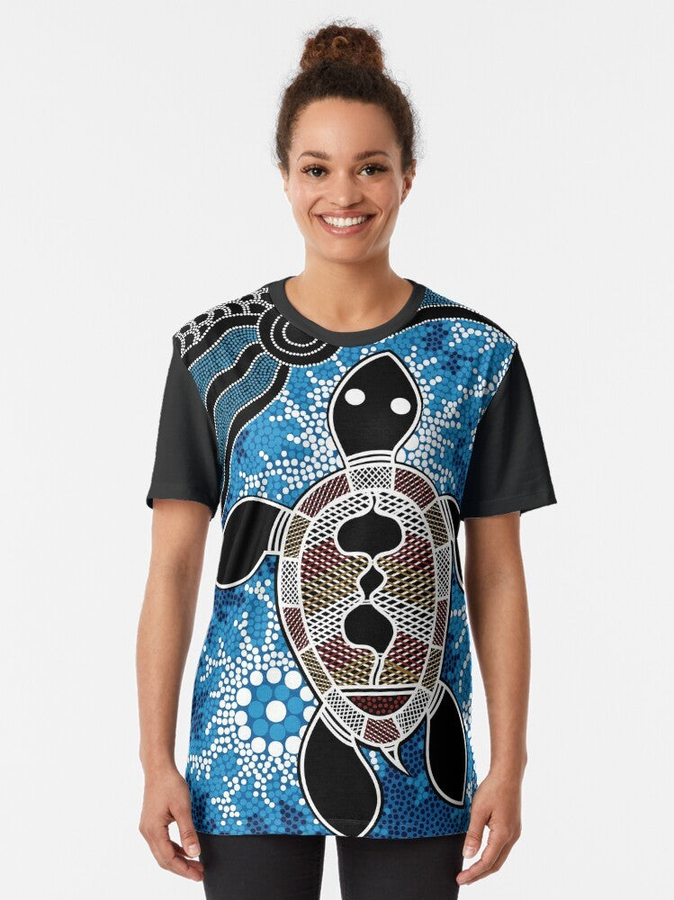 Authentic Aboriginal Art T-Shirt featuring a sea turtle design in the Dreamtime style - Women