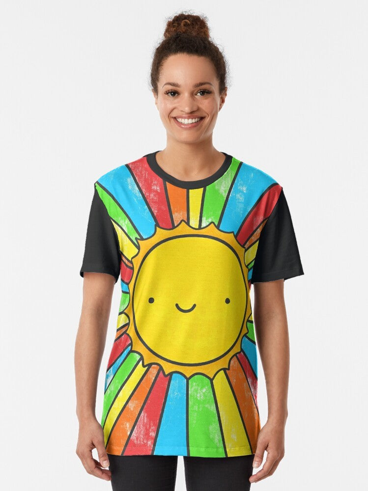 Radiate Positivity graphic t-shirt featuring a colorful design with a smiling sun, rainbows, and positive quotes. - Women