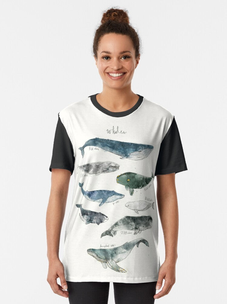 Watercolor illustration of whales, including humpback and beluga whales, on a graphic t-shirt. - Women