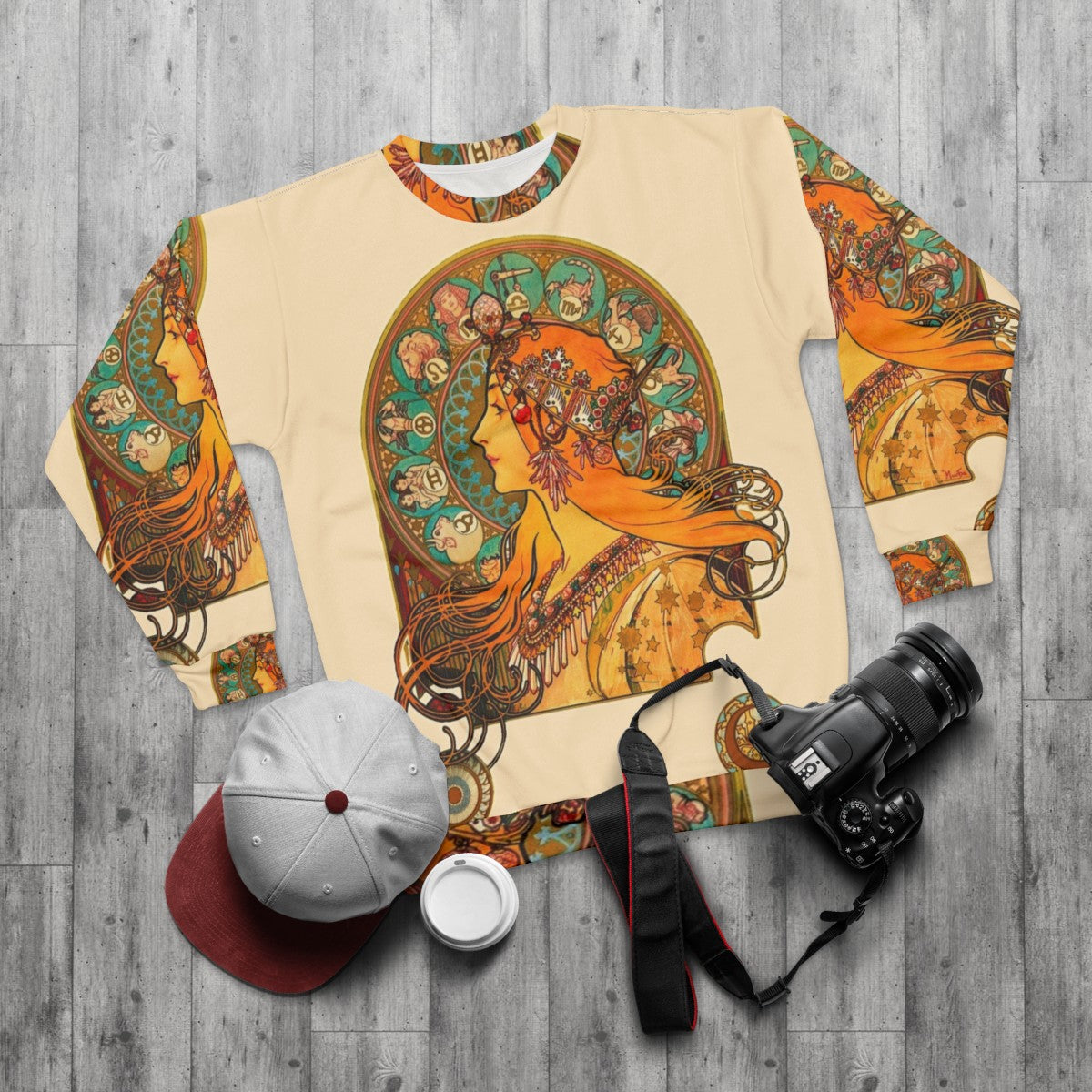 Zodiac sweatshirt with Alphonse Mucha's art nouveau style zodiac illustrations - flat lay