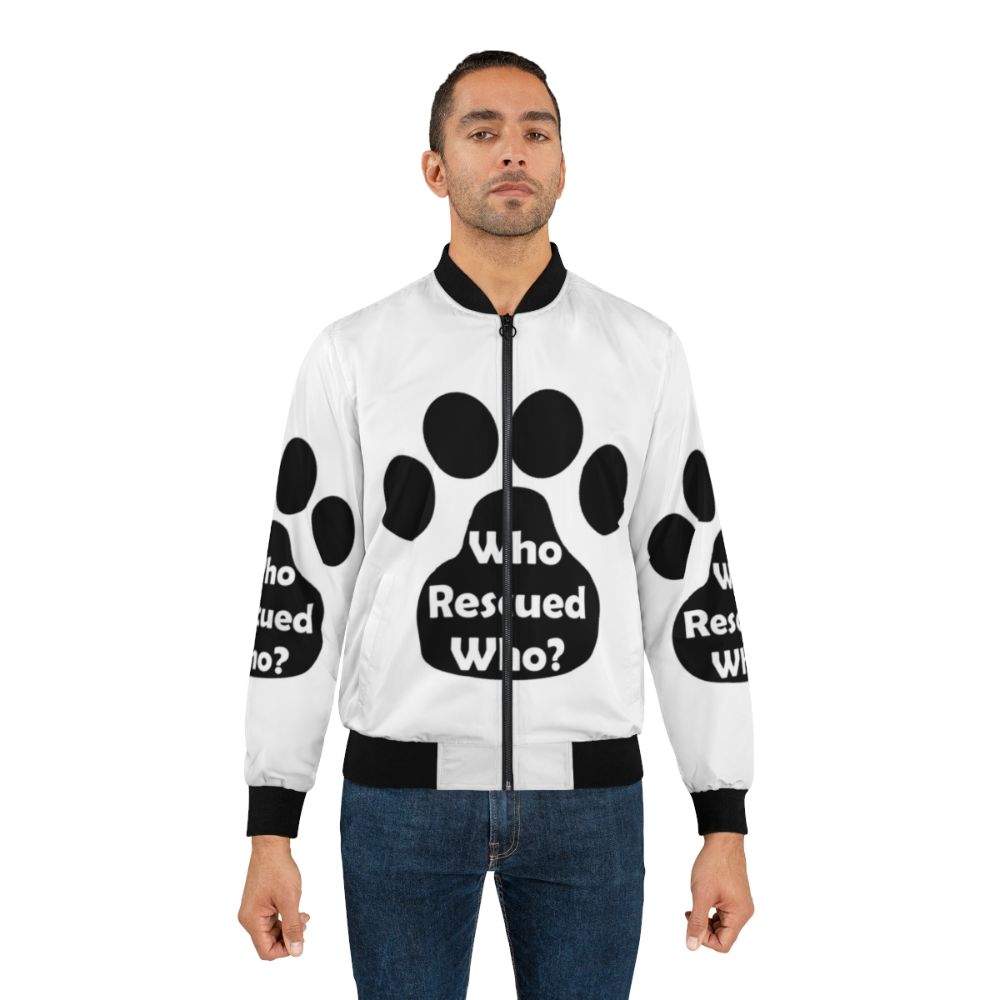 Black bomber jacket with "Who Rescued Who?" design, animal rescue theme - Lifestyle