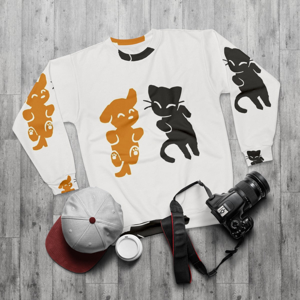 Cat and dog sweatshirt with cute animal print design - flat lay