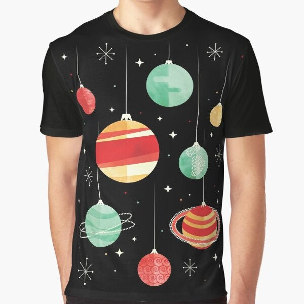 Christmas-themed graphic t-shirt featuring planets, stars, and the universe in a vintage, retro style