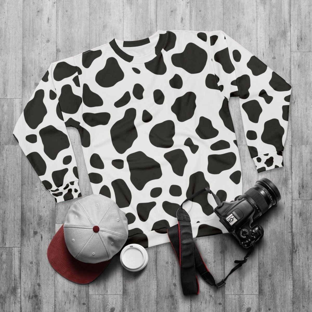 Cow print sweatshirt with a cozy, casual design - flat lay