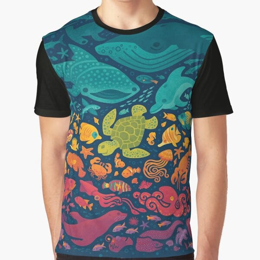 Colorful graphic t-shirt featuring a vibrant aquatic spectrum design with various sea creatures and marine life.