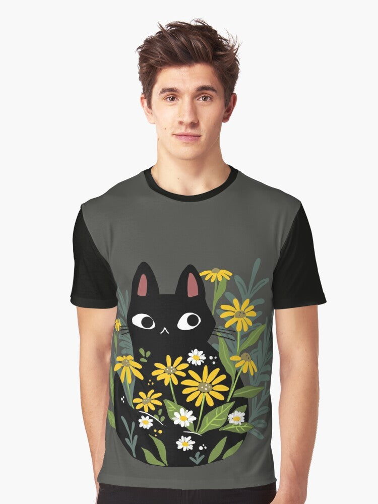 A charming graphic t-shirt featuring a black cat surrounded by vibrant flowers, creating a whimsical and nature-inspired design. - Men