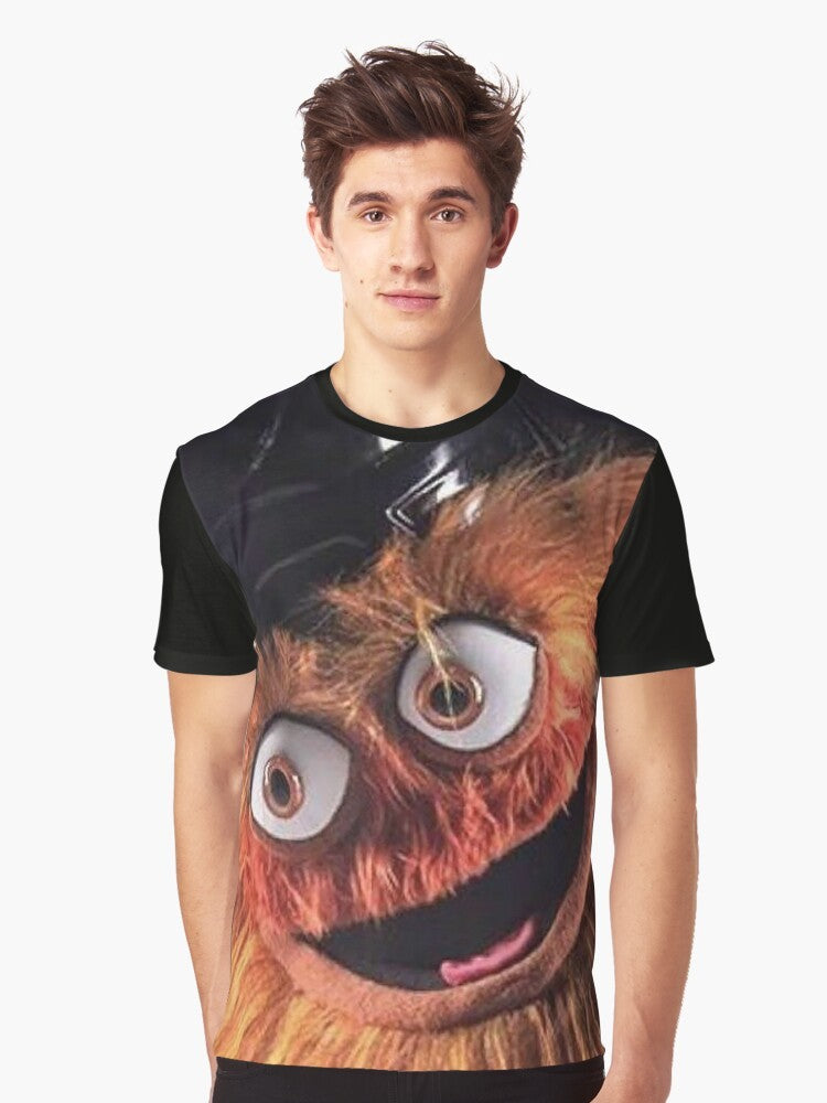 Gritty, the Philadelphia Flyers' new mascot, with a bold, graphic design on a t-shirt. - Men