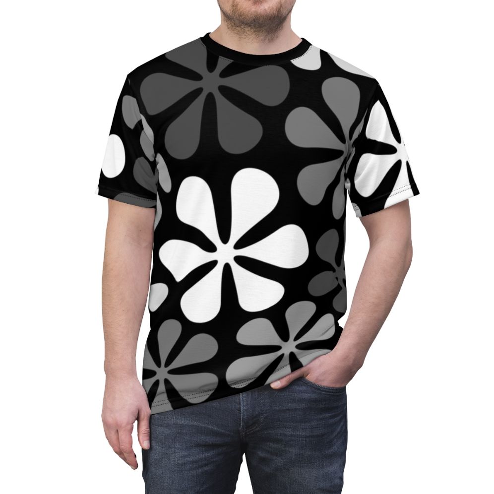 Model wearing a black and white abstract floral design t-shirt - men front