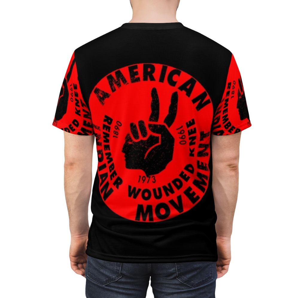 Graphic T-shirt design featuring the American Indian Movement logo and empowering message. - men back