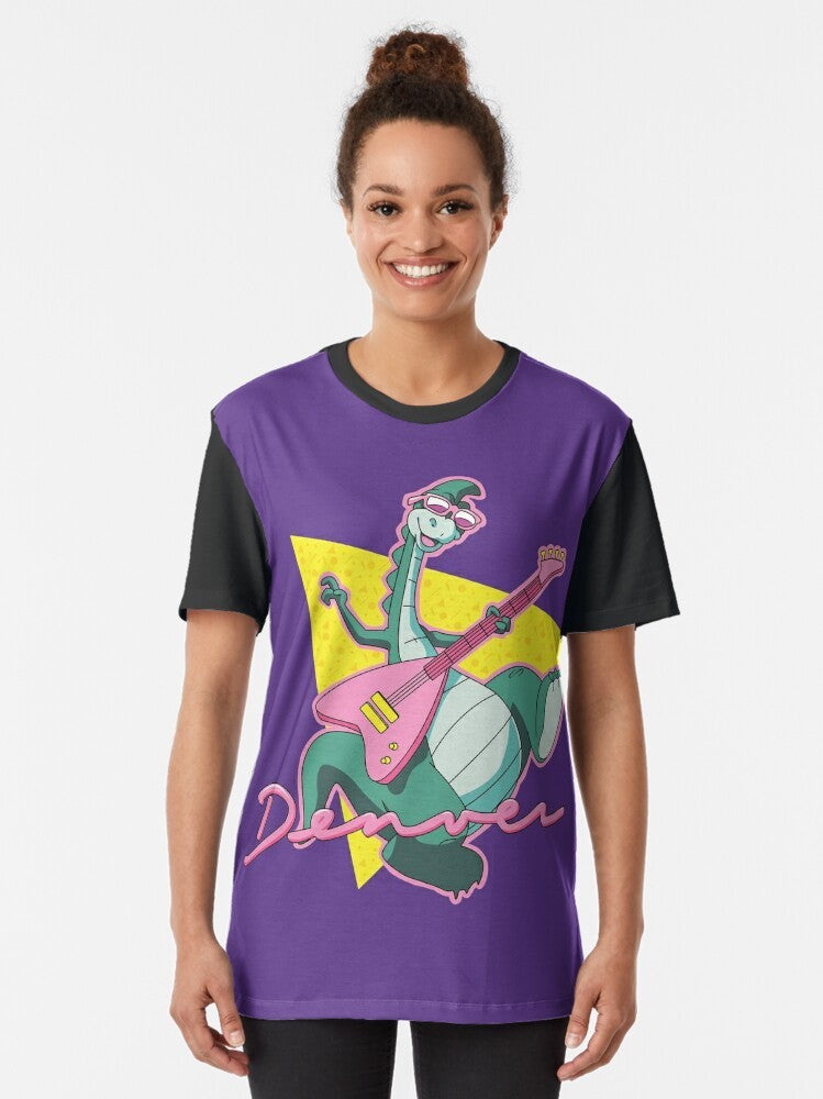 Retro 80s cartoon-style graphic t-shirt featuring "The Last Dinosaur", a nostalgic dinosaur character from the 1980s. - Women