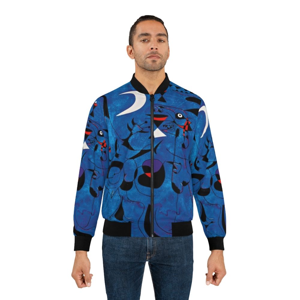 Bomber jacket featuring vibrant abstract shapes and colors inspired by the art of famous Spanish painter Joan Miró - Lifestyle