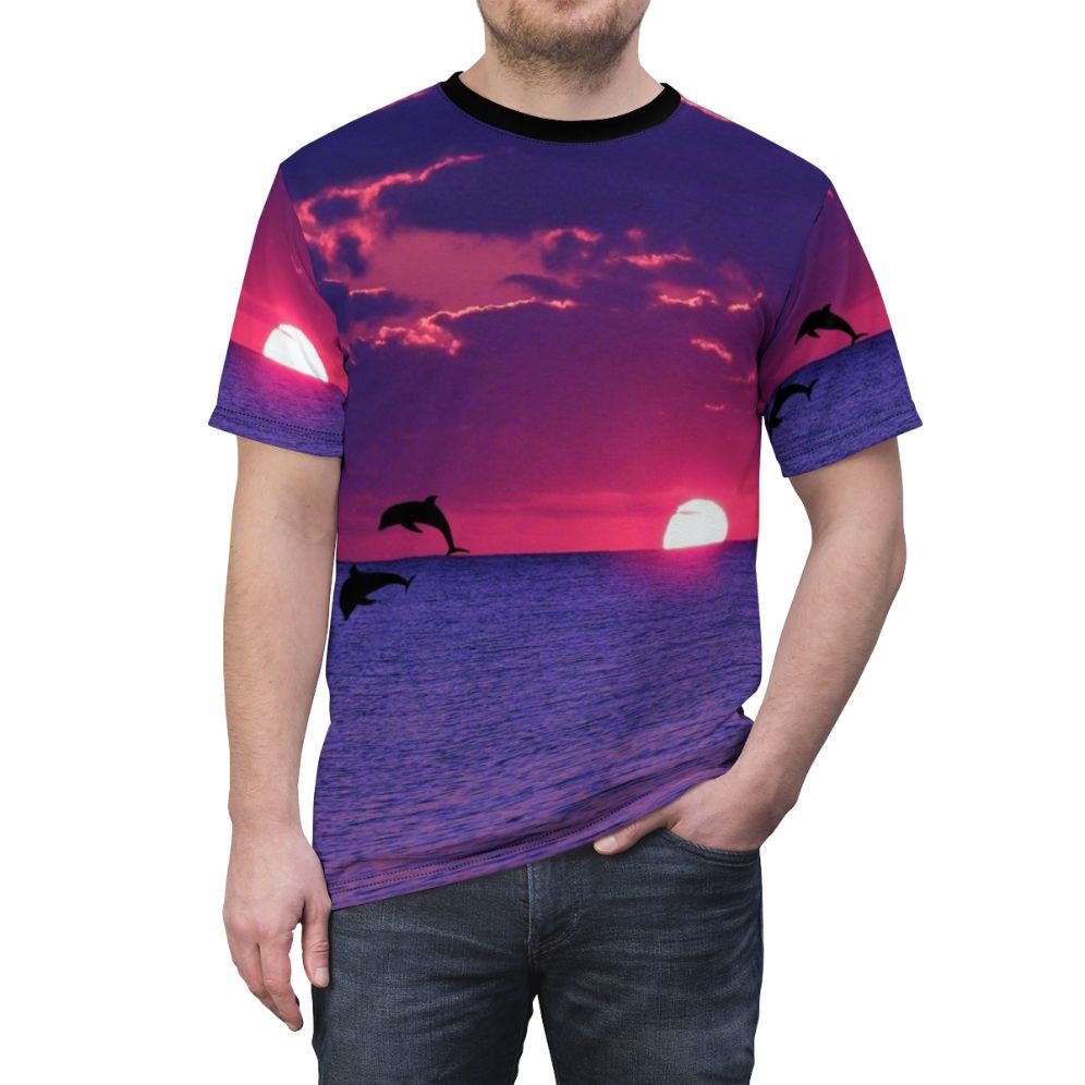 Stunning AOP t-shirt featuring a vibrant sunset sky with pink and purple hues, including a dolphin silhouette on the horizon. - men front