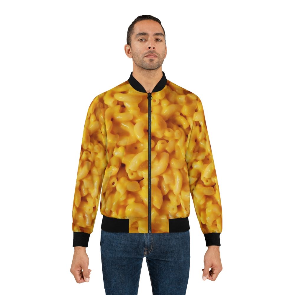 A bomber jacket featuring a graphic design of macaroni and cheese, perfect for food lovers. - Lifestyle