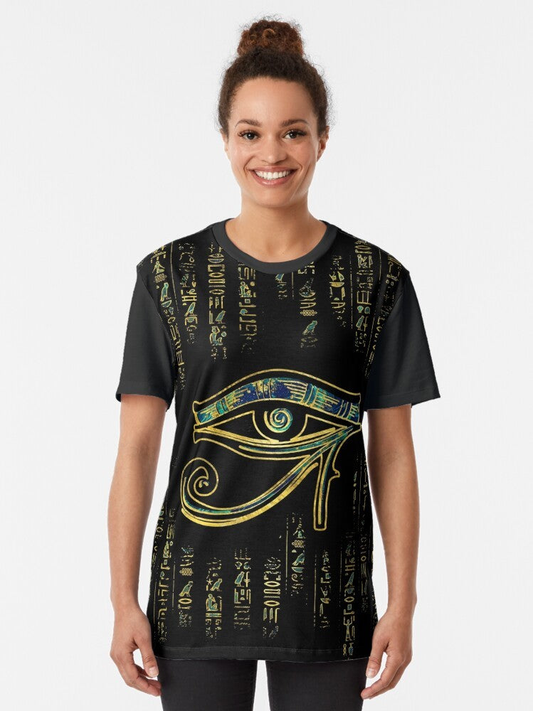 Egyptian Eye of Horus symbol on a gold and marble graphic t-shirt with hieroglyphics - Women