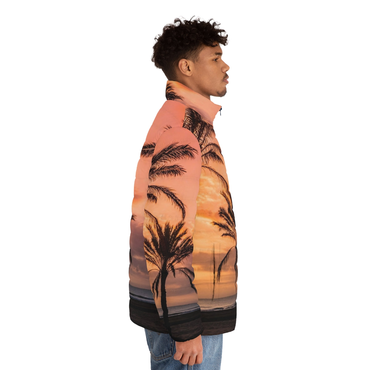 A person wearing a puffer jacket with a scenic view of the sun rising among palm trees on a beach - men side right