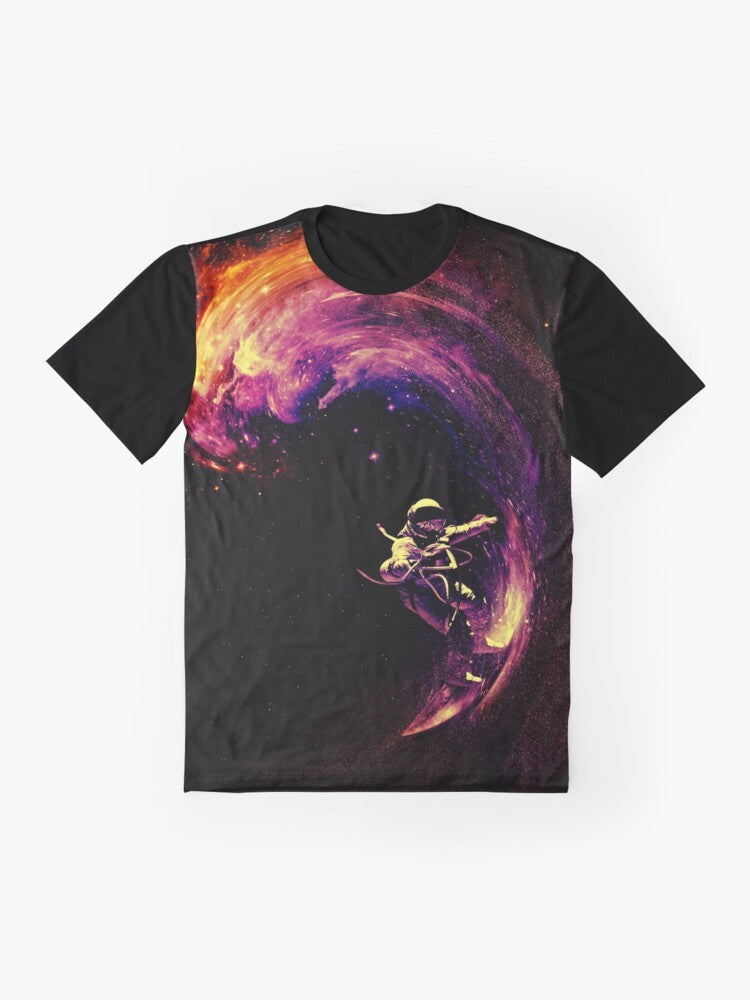 A colorful graphic t-shirt featuring an astronaut surfing through a cosmic galaxy with stars and planets in the background. - Flat lay