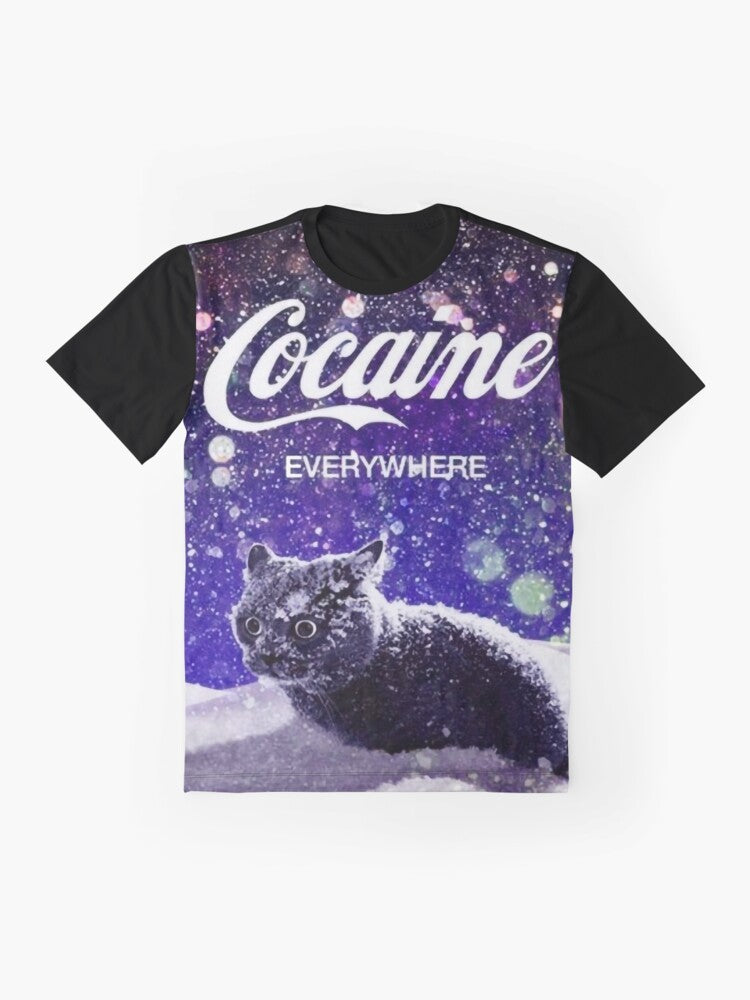 A graphic t-shirt design featuring a cat surrounded by snow and 'cocaine' written in a stylized text. - Flat lay